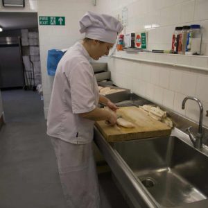 Preparing the fish in our kitchen